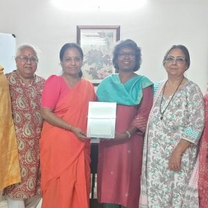 Dr Devasena handing the HK Certificate to EC members